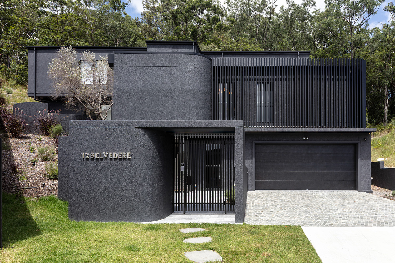 Modern Steel‑Frame Hillside Residence with Pool